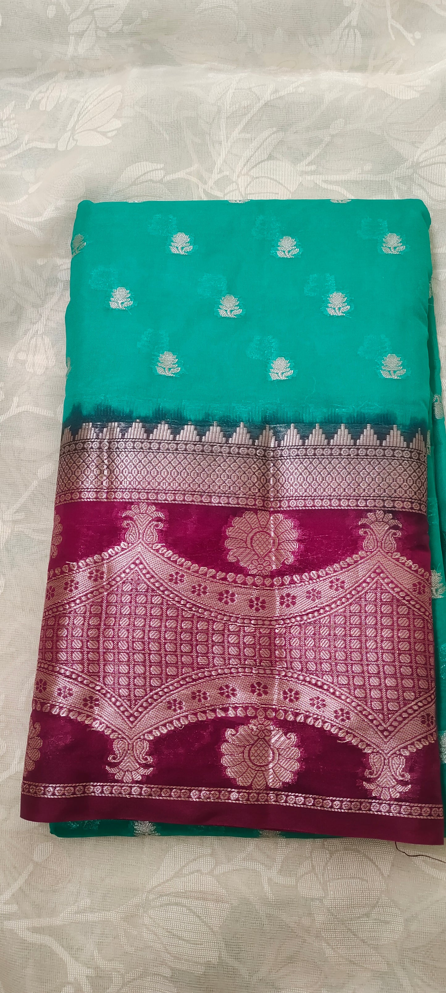 Trquish blue color with pink border silk saree
