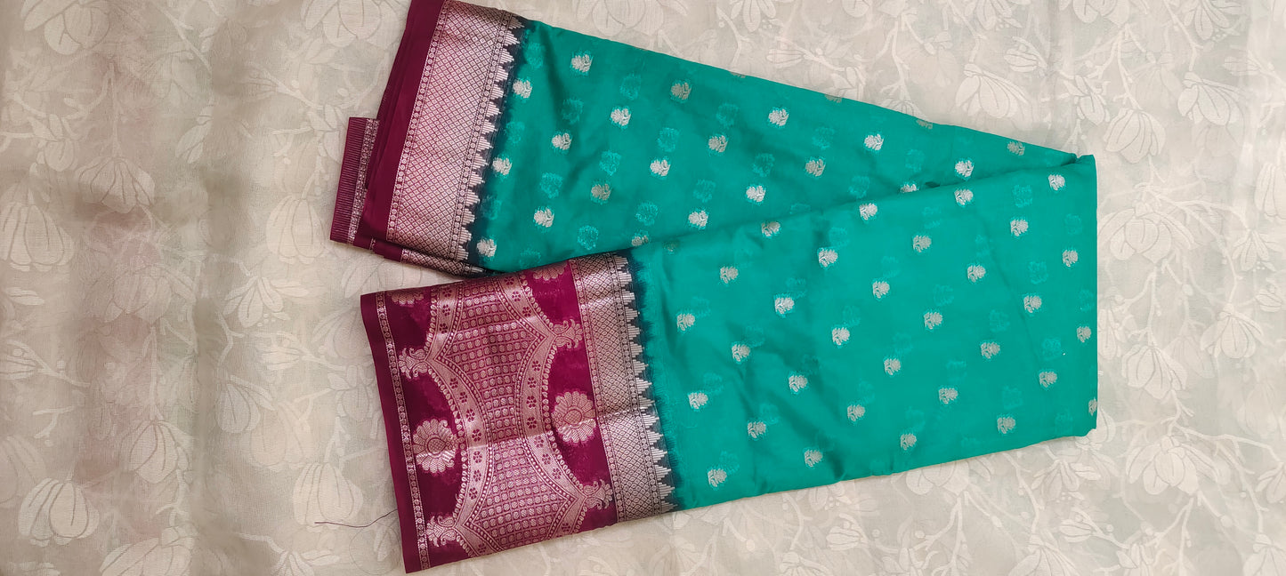 Trquish blue color with pink border silk saree