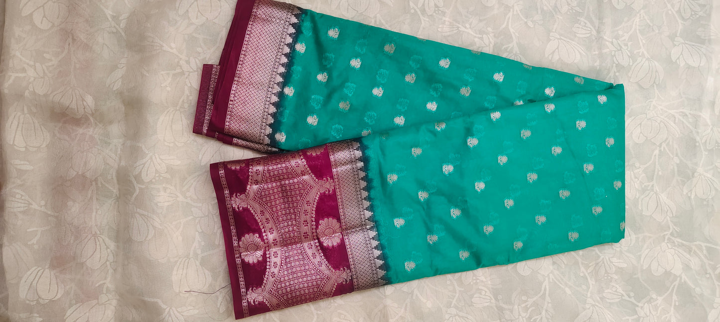 Trquish blue color with pink border silk saree