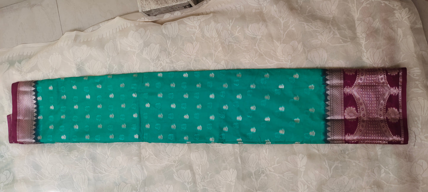Trquish blue color with pink border silk saree