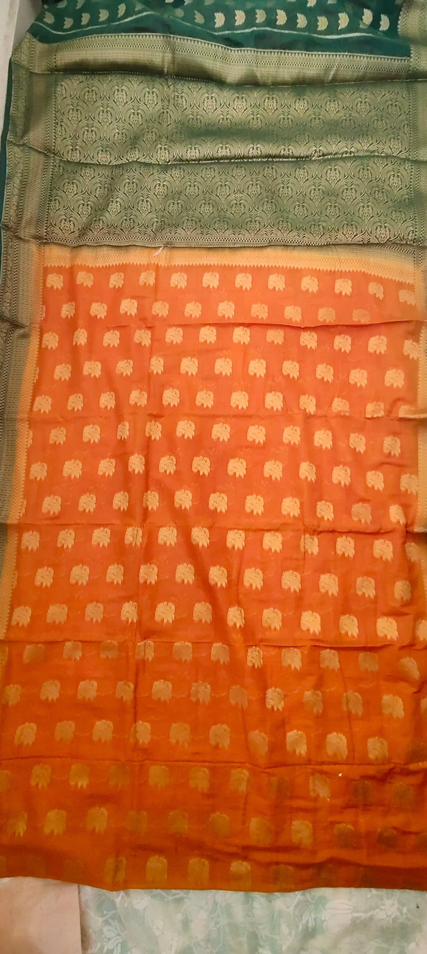 Yellowish Orange color with Green border silk saree
